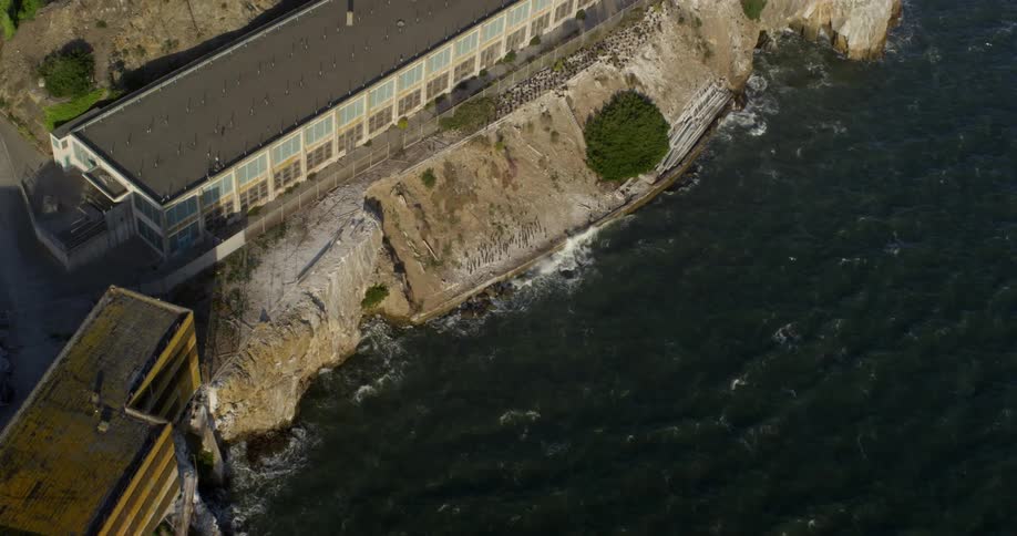 An aerial view of buildings on a rocky coastline