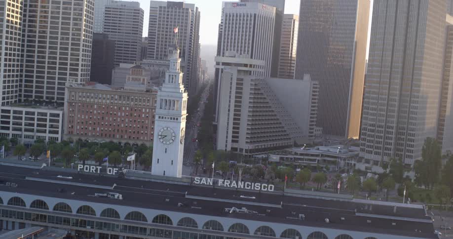 Aerial view of a port and skyscrapers behind it