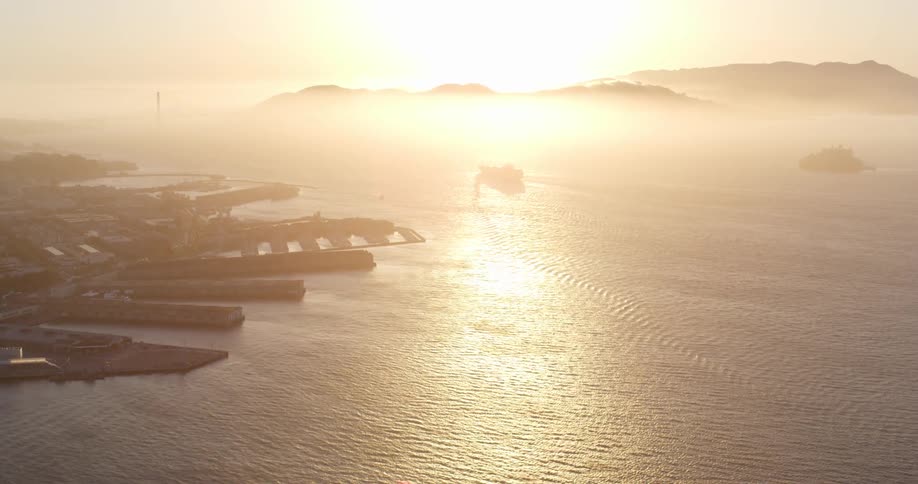 Aerial view of a city harbor at sunset