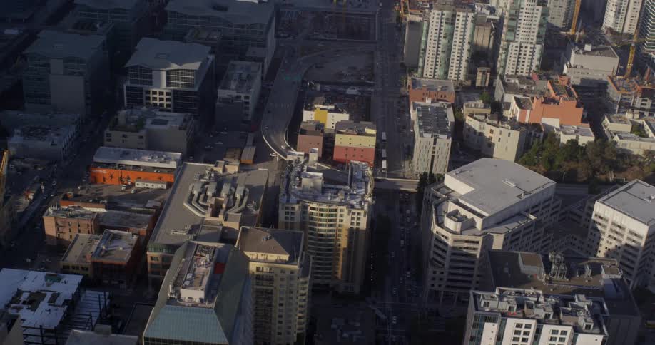 Aerial view of office buildings in a downtown area right off the water