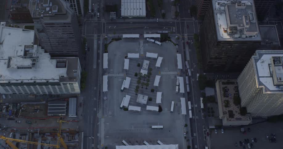 Aerial view of rooftops of buildings with streets in downtown