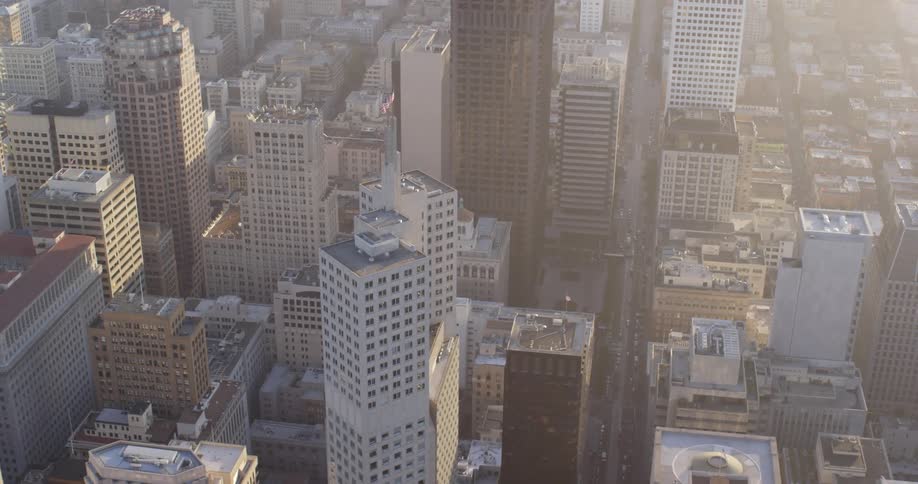 The tall buildings and skyscrapers of a city during the day