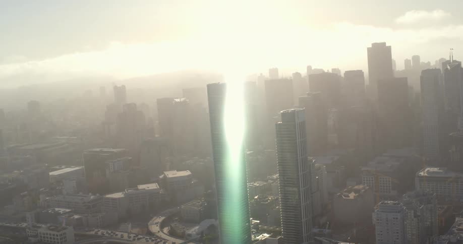 The smog is covering the tall buildings in the city