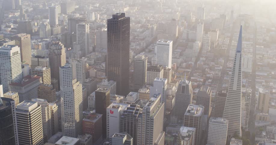 An aerial view of a downtown city is displayed