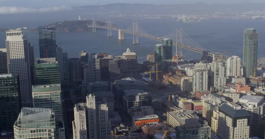 An aerial view of a downtown city is displayed