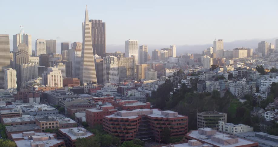 An aerial view of a downtown city is displayed