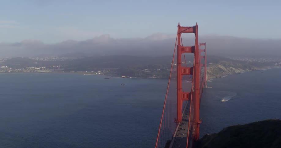 Aerial view of vehicles crossing the golden gate bridge over the san francisco bay with with san francisco in the background