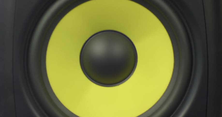 A speaker vibrates due to sound waves