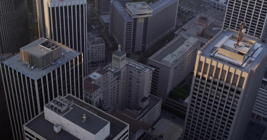 Aerial view of rooftops of buildings and streets in downtown area