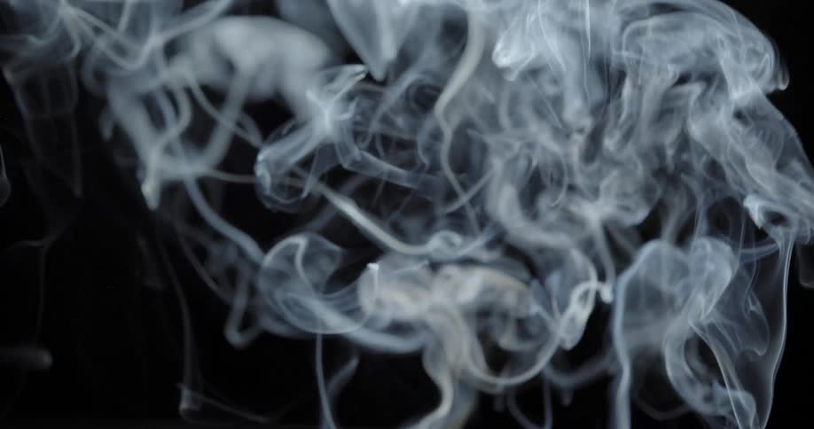 Smoke billowing up in the darkness
