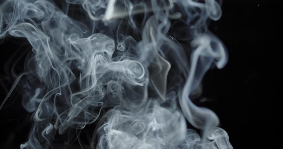 The smoke rises in the dark area