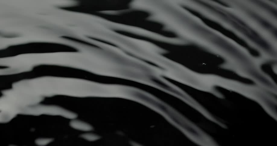 Ripples spreading throughout a dark liquid