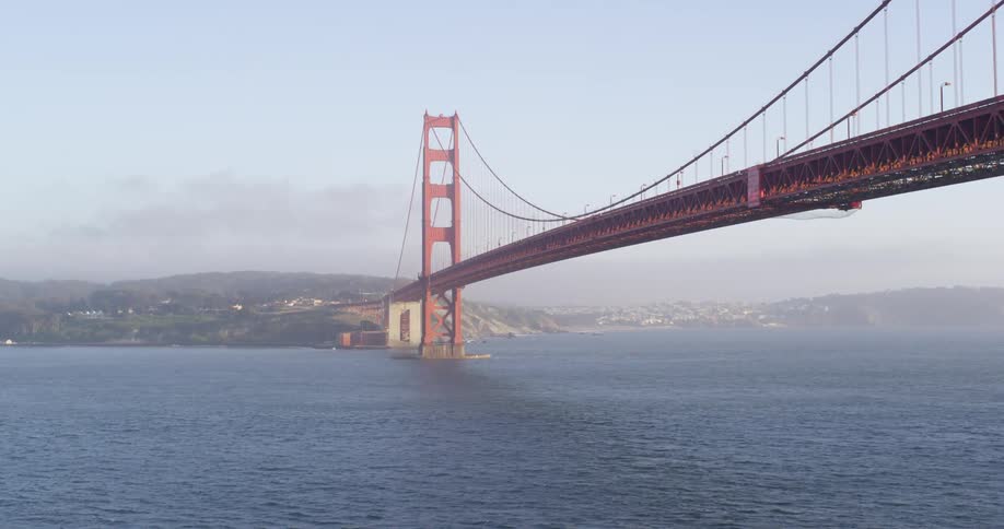 Below view of golden gate bridge with cables hanging from towers