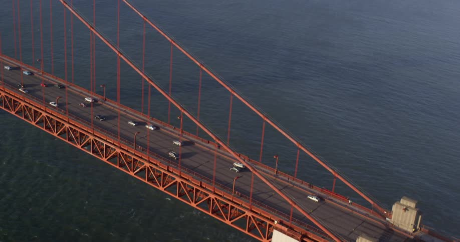 Vehicles drive along the golden gate bridge