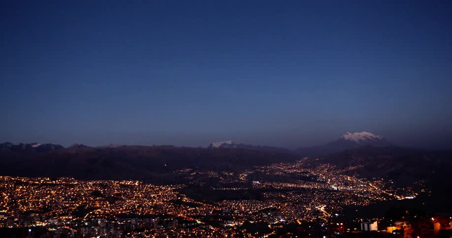 Aerial view of a city skyline all lit up