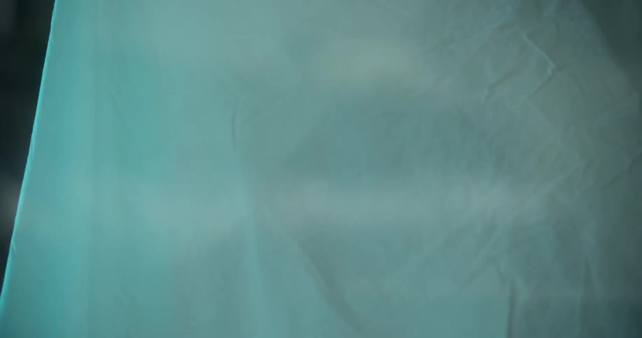 A sheet is wrapped around a woman