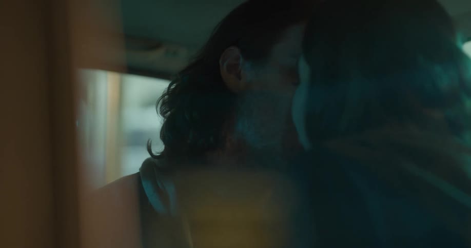 Couple making out in the back seat of a car