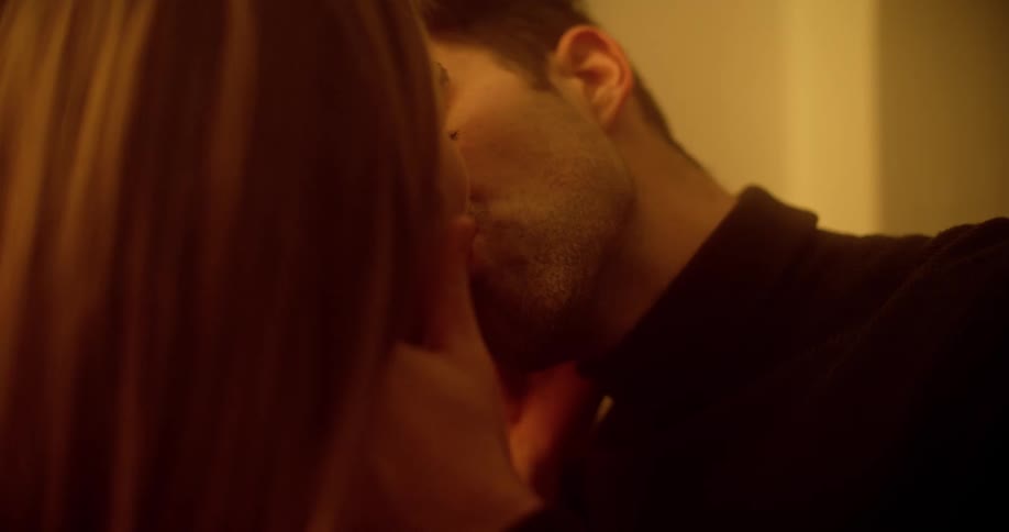 A man and woman make out