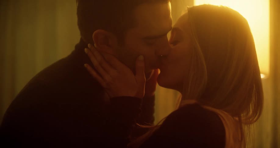 A man and woman kiss and make out