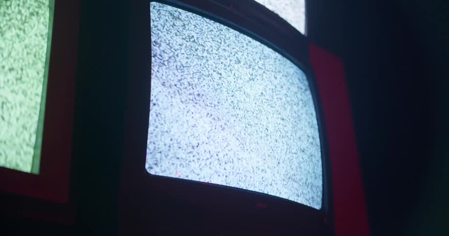 Vintage television screens showing static