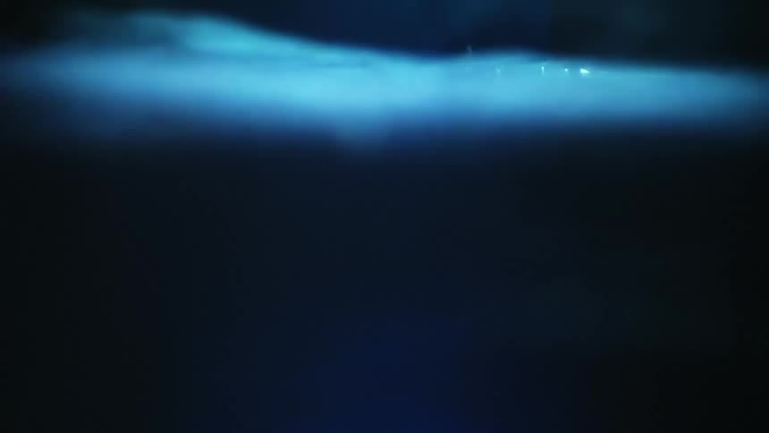 Blue fabric rippling in light and shadow