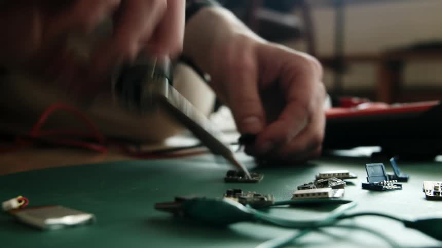 A man works with electrical circuits