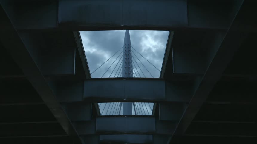 A tower with cables suspends a bridge platform