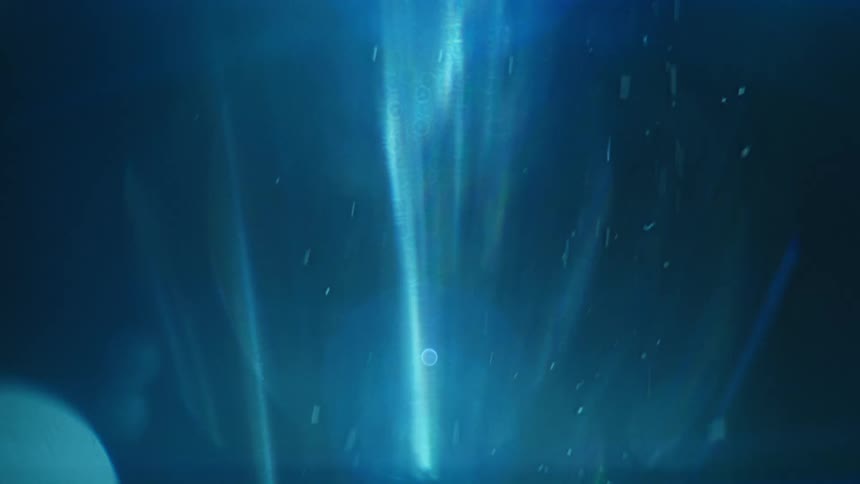 Snowflakes fall in the night sky