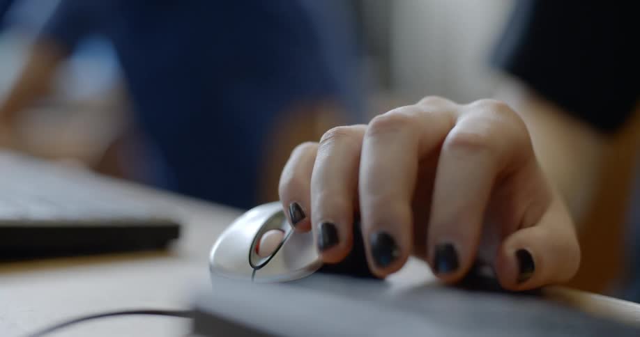 Woman uses a keyboard and mouse