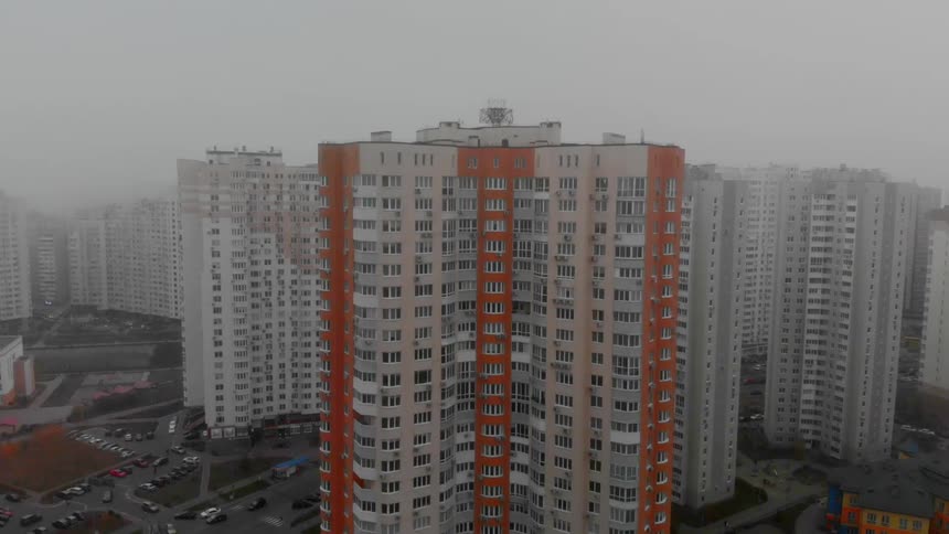 Heavy fog covers the apartment buildings