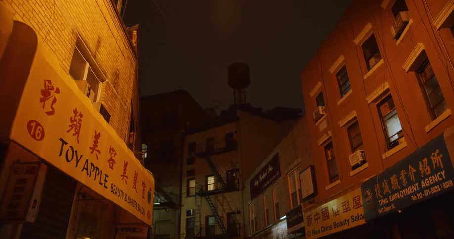Chinese storefronts on a small town street at night