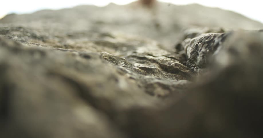 Pieces of stone fall from the cliff