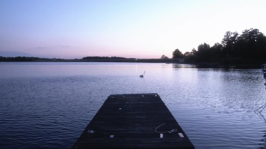 The sun is setting on the lake