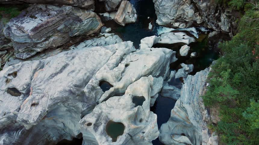 Water flows at the base of a canyon