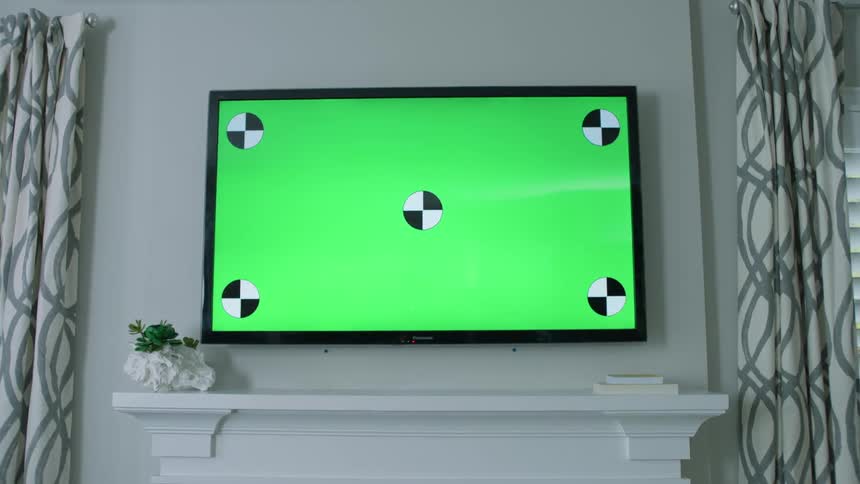 The monitor sits above the mantle