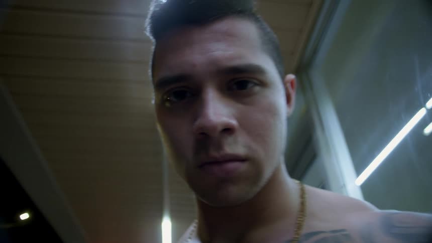 The camera zooms in on the mans face