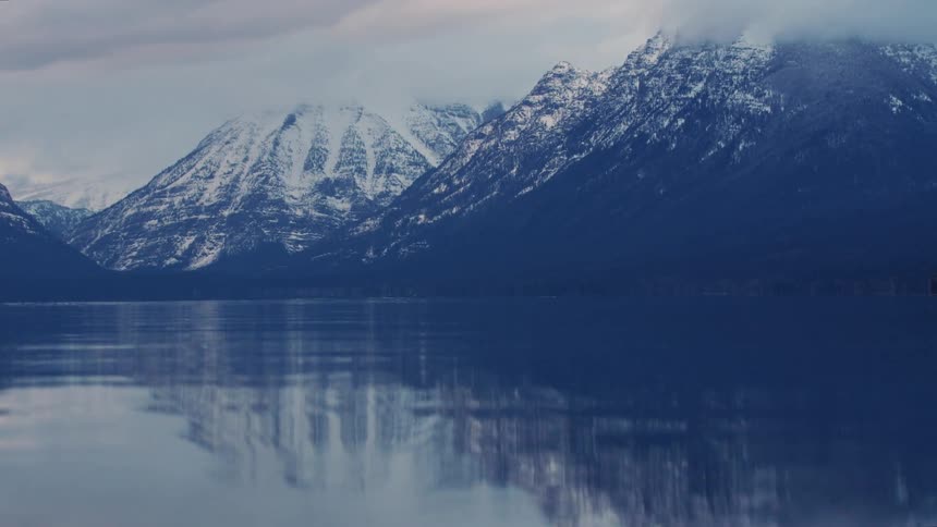 Landscape view of a lake in front of a mountain range