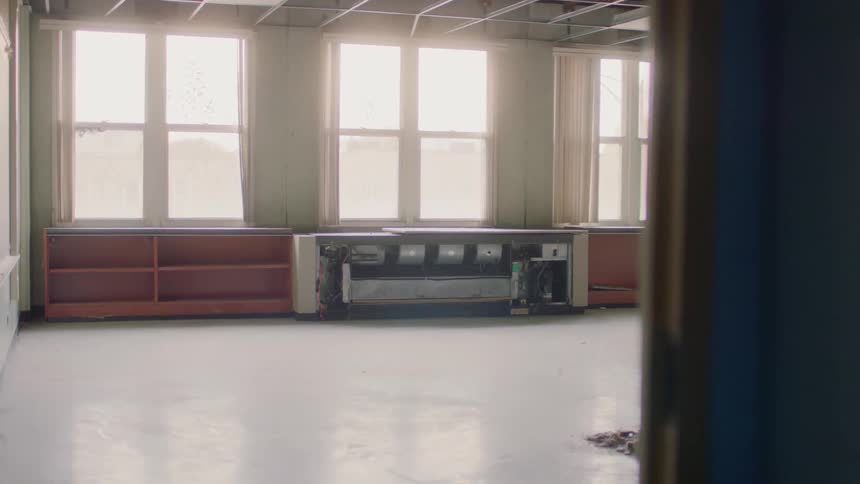 The room is empty except for some rubble in the corner