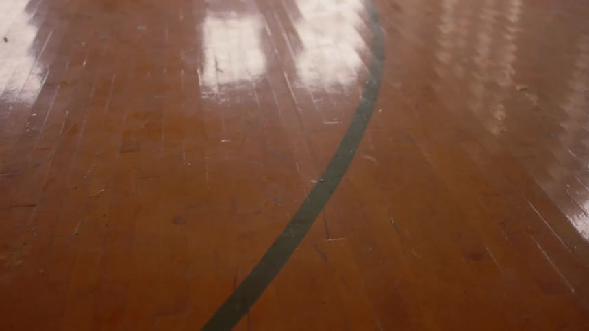 Sunlight reflecting from windows off of a gym floor