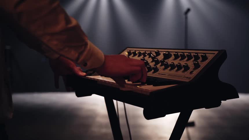 A person is playing a keyboard