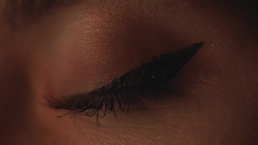 A white womans eye is closed