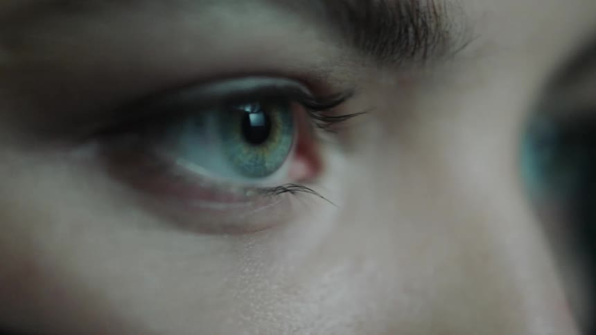 Woman blinks her hazel color eyes
