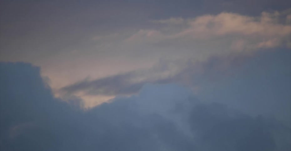 Blue sky is visible beyond fluffy white clouds