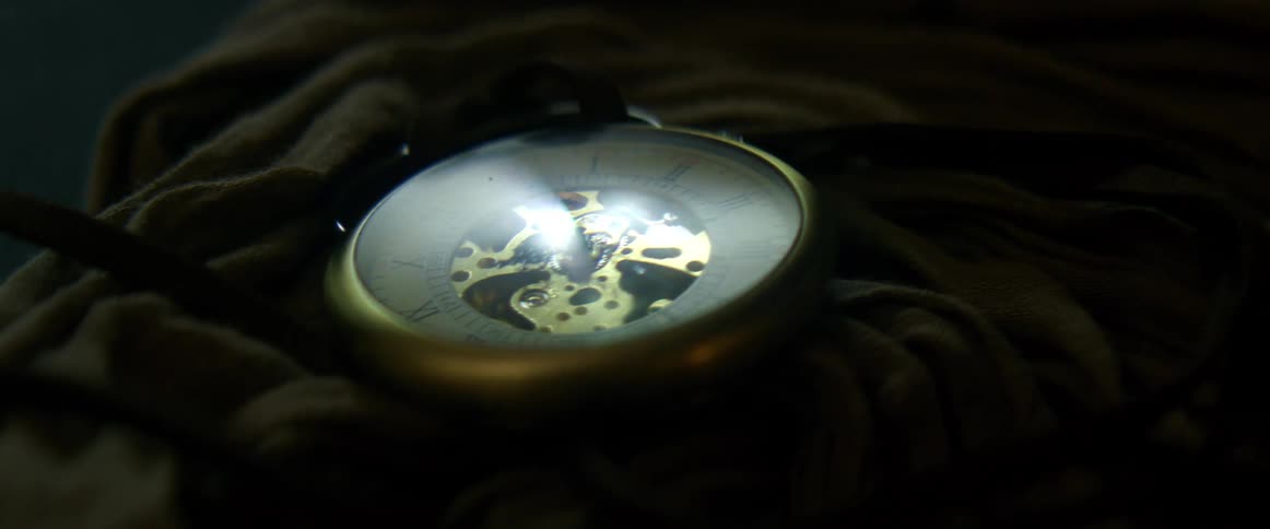 A time piece lying on a piece of cloth