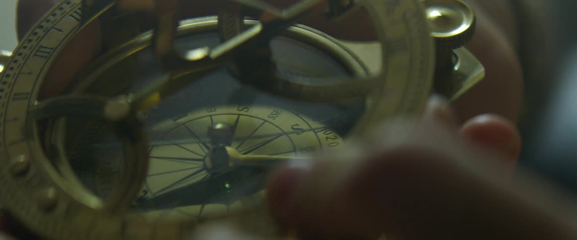 Attachment with roman numerals is put on top of a compass