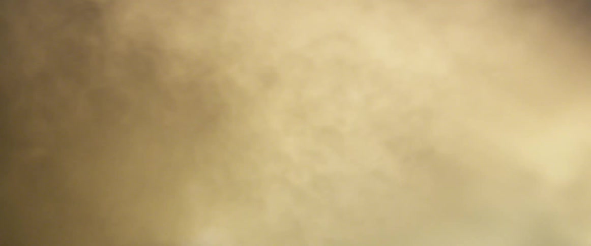 Clouds of yellow dust or steam blowing in the wind