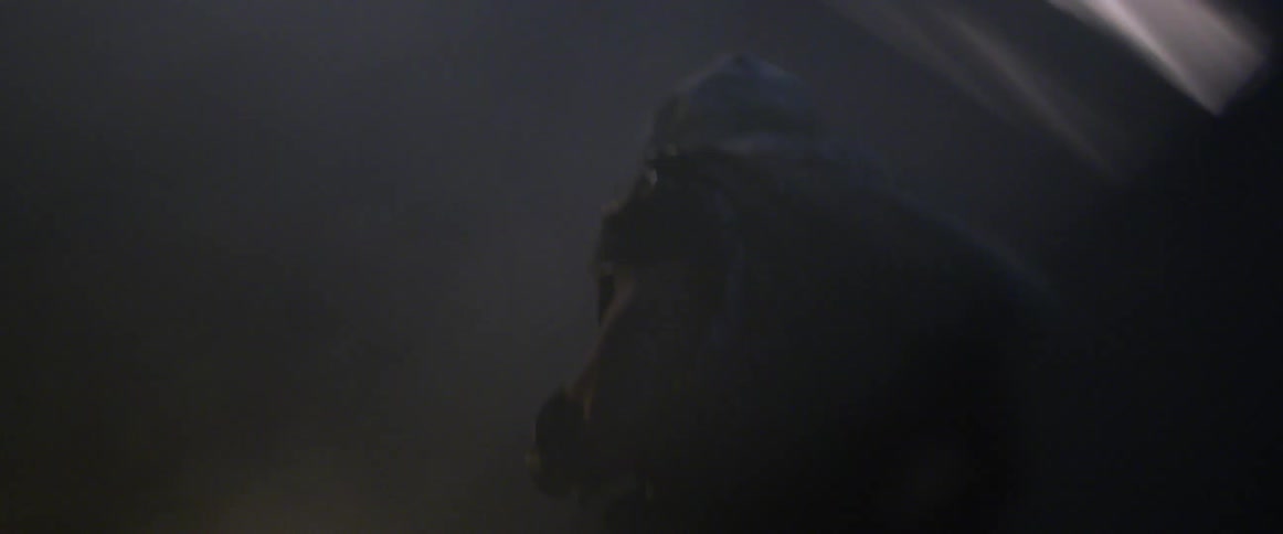 A man is running through smoke