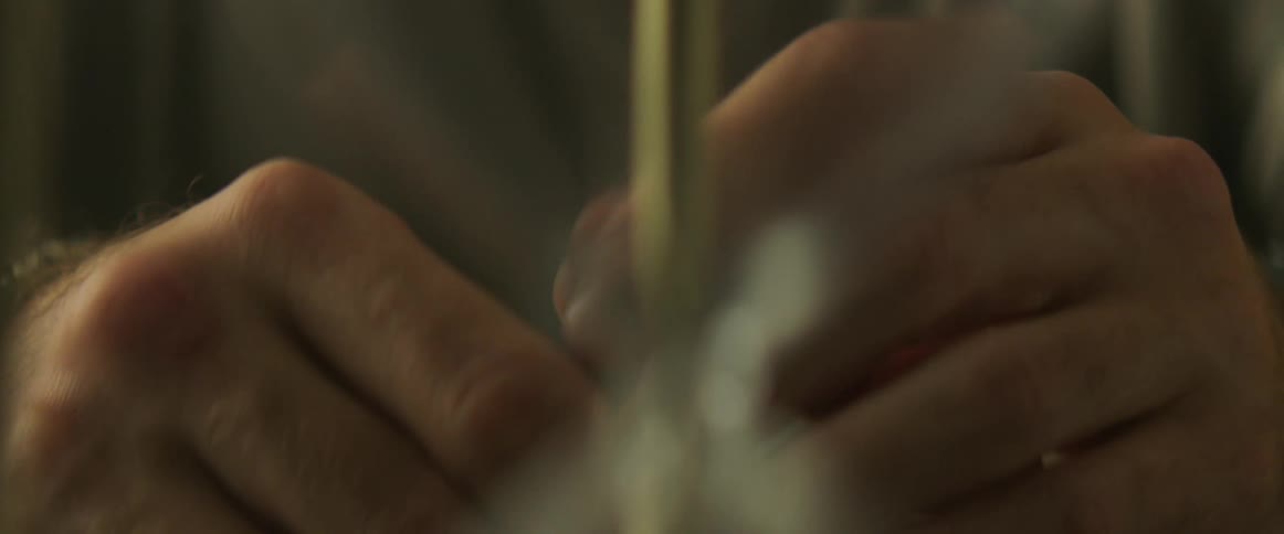 Close up of a man brushing his hands togheter