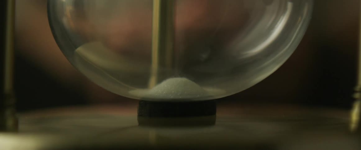 Sand falling in an hourglass