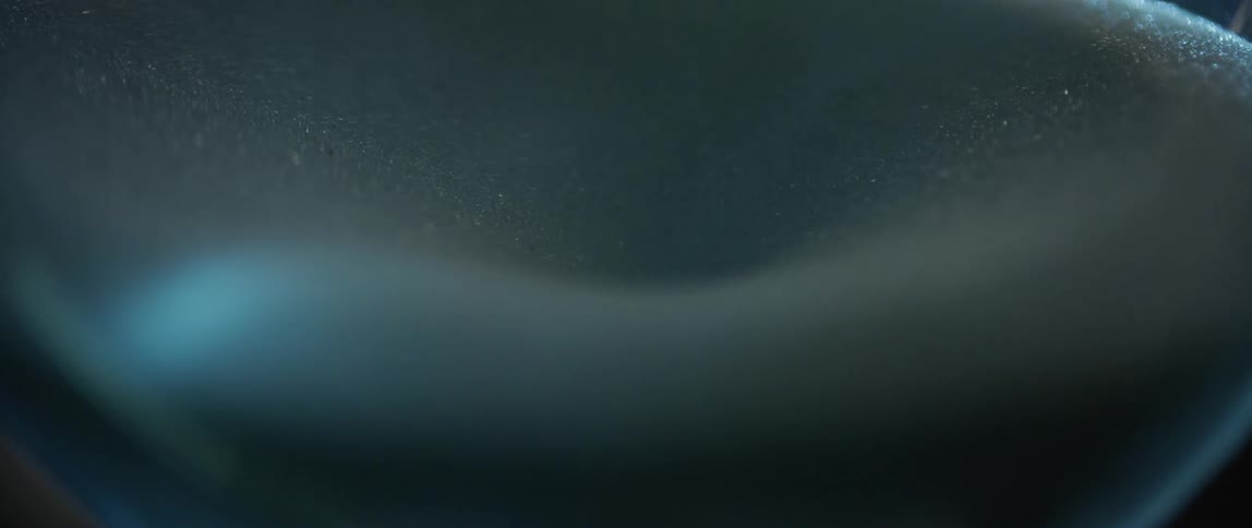 Small shiny granules sit on the white surface